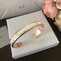 DIOR CODE BANGLE GOLD-FINISH METAL AND LACQUER WOMEN